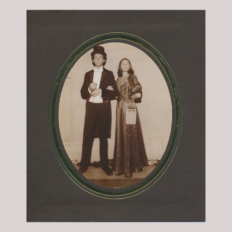 
        Old fascion picture with man and woman in frame.